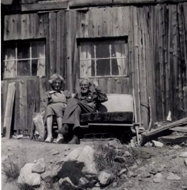 Vtg Photo - Old Couple sitting in front of cabin | Summer 1959