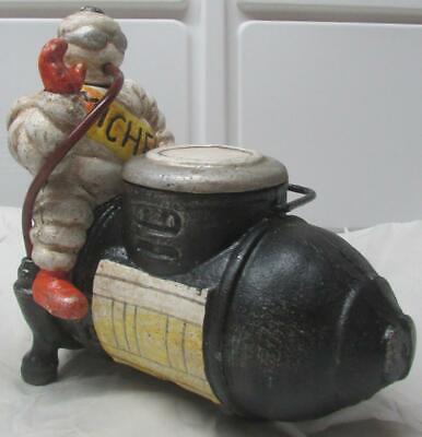 A Super Heavy Cast Iron Michlan Man Bibendum Sitting On Compressor