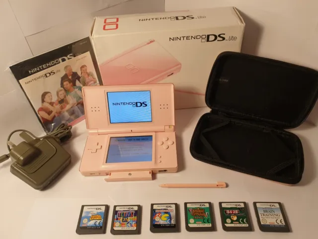 Nintendo DS Lite Console Pink with 6 games , charger ,case and box.