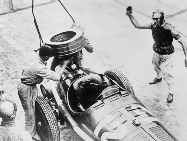 Tazio Nuvolari Waiting For His Car To Be Refuelled Motor Racing Old Photo