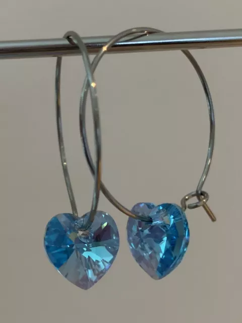 Silver Tone Hoop Earrings With Beautiful Blue Swarovski Crystal Heart Pendants