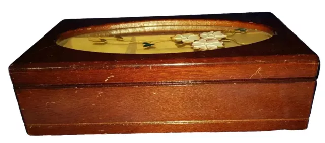 A Brown rectangular musical jewellery box with a floral Design On The lid