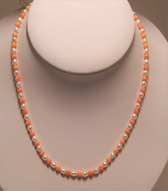 New hand strung  fresh water cultured pearl & pink coral bead necklace.