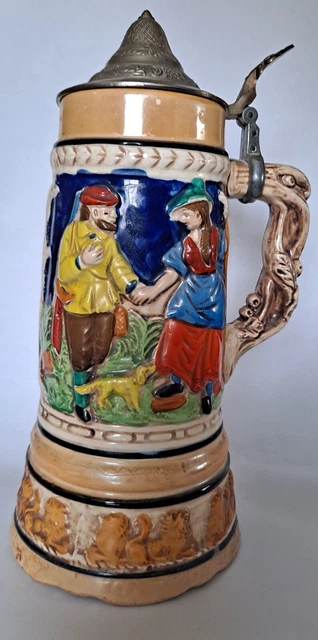 Vintage beer stein, pewter lid, lions around the base