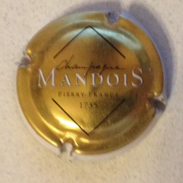 Capsule de Champagne MANDOIS (1. or contour blanc)