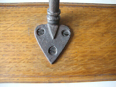 Antique original cast iron coat rack hooks on reclaimed oak board 3