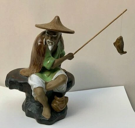 Miniature Glazed Ceramic Green & White Figurine Fisherman 4.0 x 6.0 x 8.5" Tall