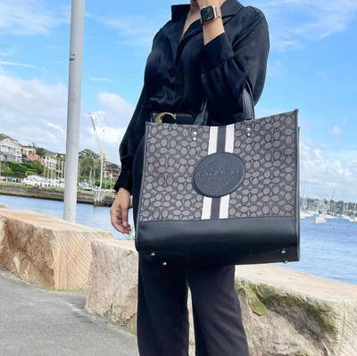 black vinyl crossbody bag