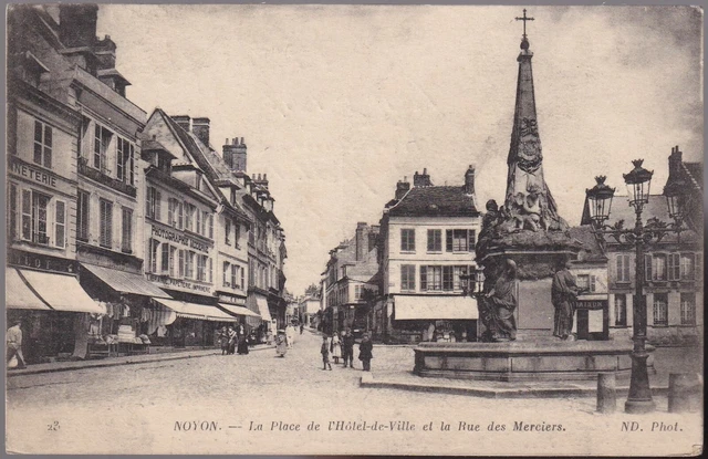 NOYON 60 Place Hôtel de Ville rue des Merciers Commerces CPA animée écrite 1917