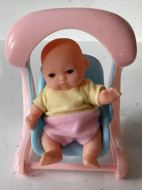 Baby doll online swing toy