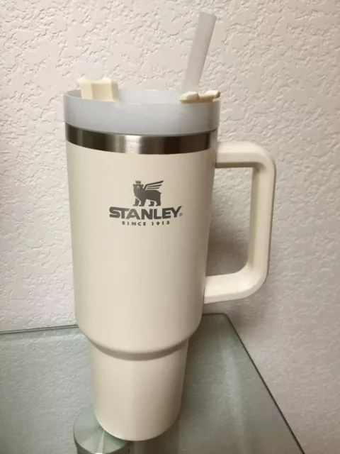 https://www.picclickimg.com/cm8AAOSw~NRi9oOH/Stanley-Adventure-Quencher-40oz-Cream-Insulated-Travel-Mug.webp