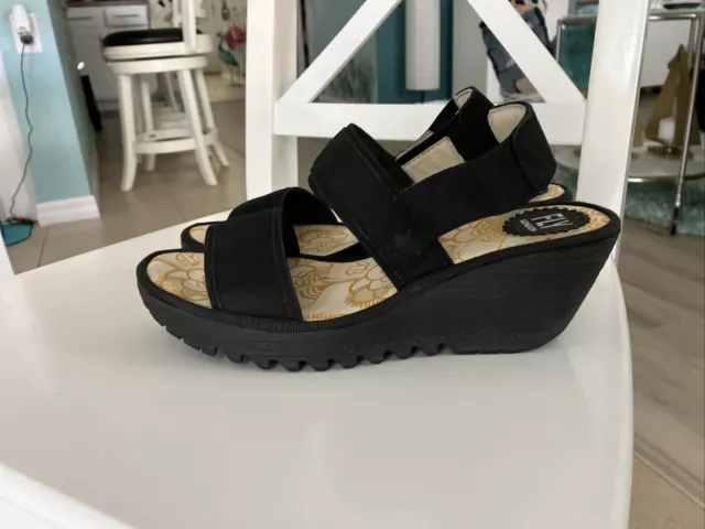 Excellent  ￼Fly London Black Wedge Pull On Sandals size 38/7