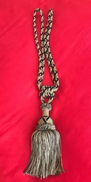 One Taupe and Black  Curtain Tie Back with 7" tassel.