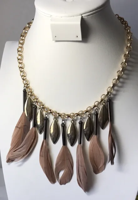 Charming Charlie necklace with hanging tan / brown feathers, Gold Tone