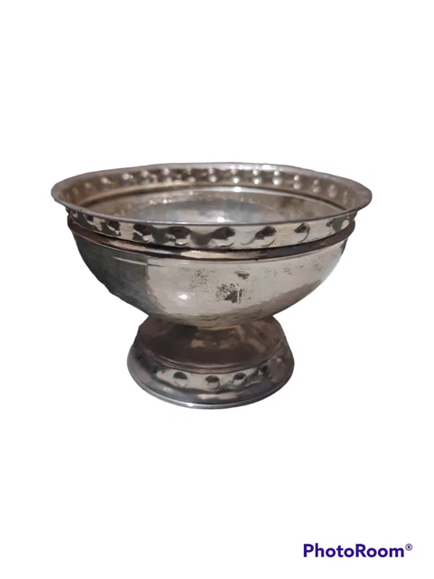 A Silver Vase With An Engraved And Ornate Vase Base