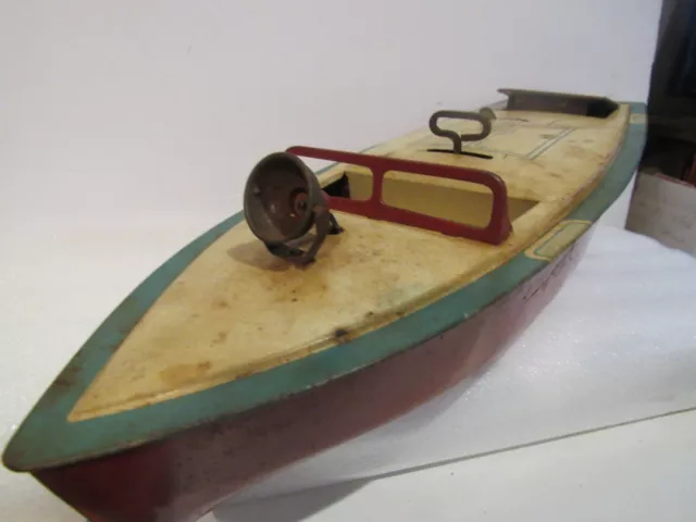 https://www.picclickimg.com/cwIAAOSw6bFk6O37/Vintage-Tin-Battery-Operated-Speed-Boat-Rudder-Handle.webp