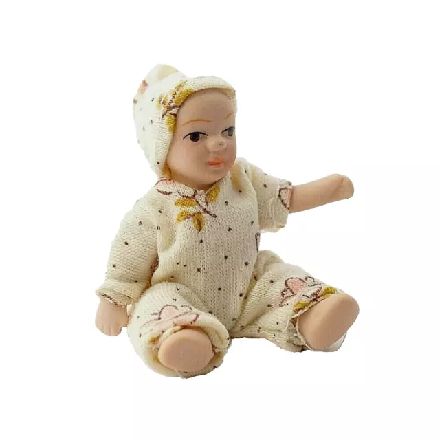 DOLLS HOUSE DOLL 1/12th SCALE TODDLER/ BABY IN CREAM FLORAL BABYGRO