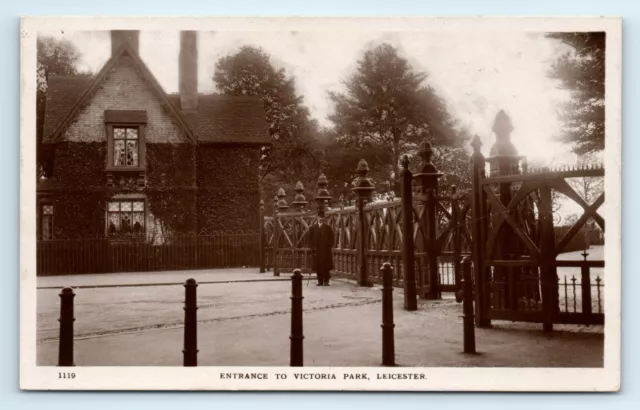 POSTCARD Leicester, Entrance to Victoria Park, man at gates, real photo RP