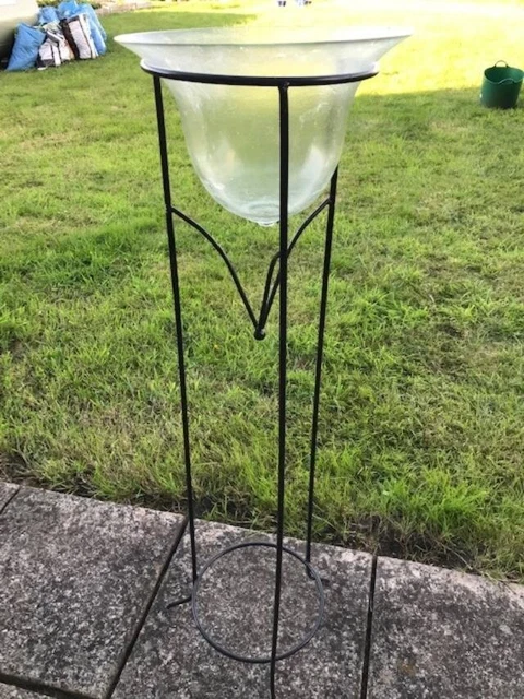 Tall metal plant stand with glass base