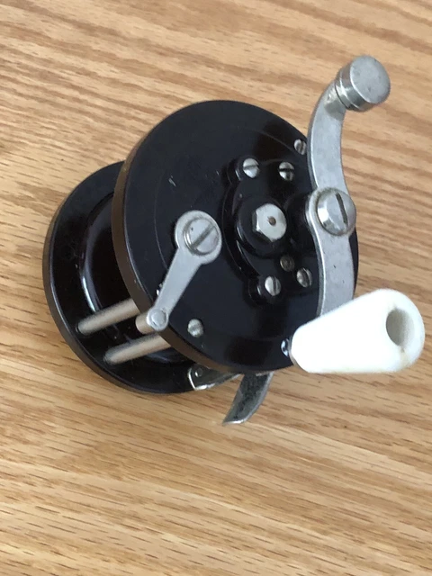 A collection of vintage fishing reels, spools and more