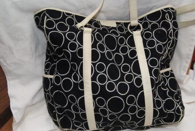 Tumi tote bag, black wool with cream circles and cream leather trim