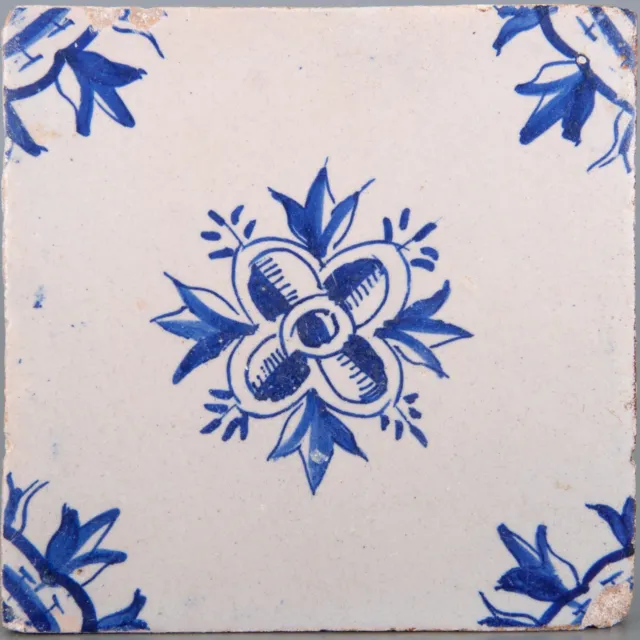 Nice Dutch Delft blue ornament tile, flower, 17th. century.