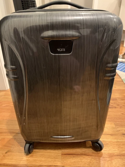 Tumi hard shell carry on. Used once!