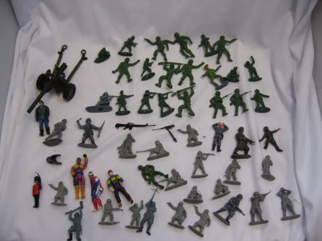 Bundle of retro plastic toy soldiers and a metal gun
