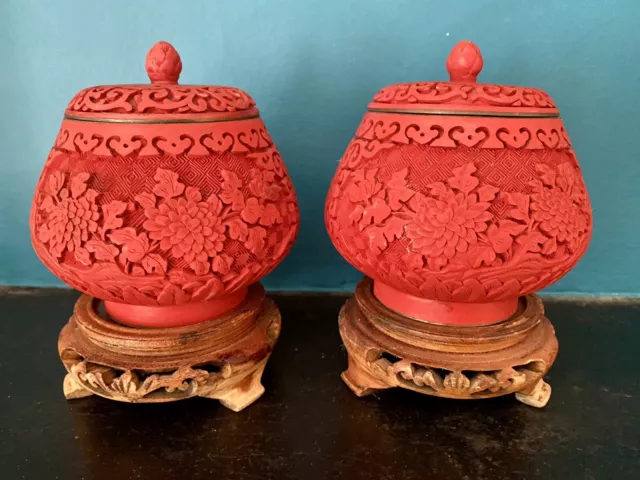 Lovely Vintage Pair Of Red Cinnabar Floral Lidded Pots On Carved Wooden Bases