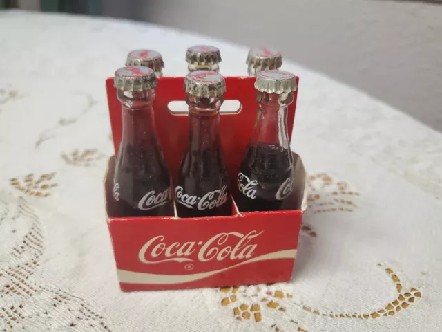 Miniature Six Pack of Glass Coca Cola Bottles in Paper Carrier