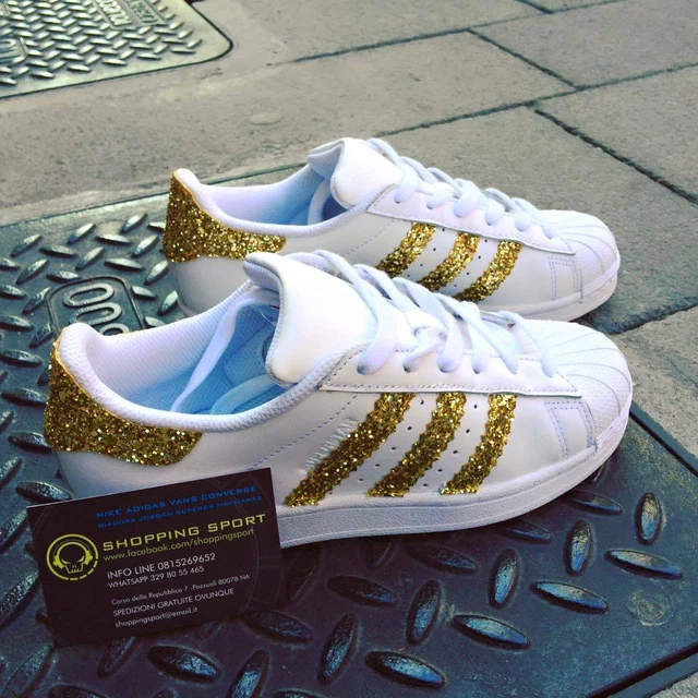 Superstar bianche store con strisce oro