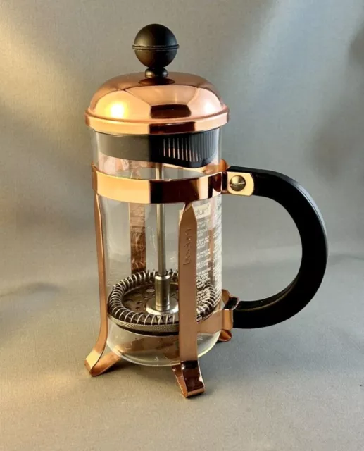 https://www.picclickimg.com/dH4AAOSwKqhlHT9J/Bodum-Chambord-Coffee-Maker-French-Press-Copper.webp