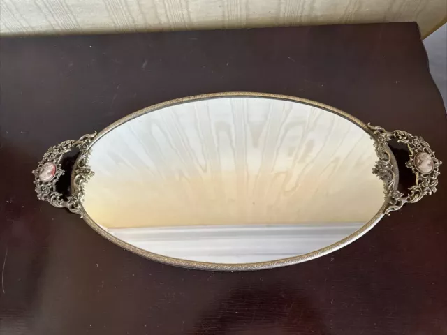 Antique gold tone ornate brass vintage oval vanity mirror tray w/ cameo handles.