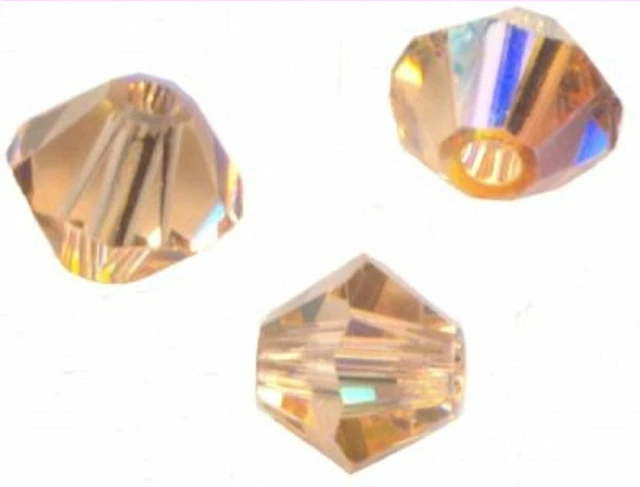 site parisien  40 PERLES TOUPIES SWAROVSKI   5mm   LIGHT PEACH