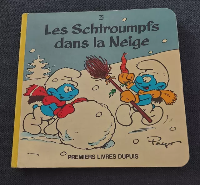 Livre les schtroumpfs dans la neige dupuis peyo cartonné 1983