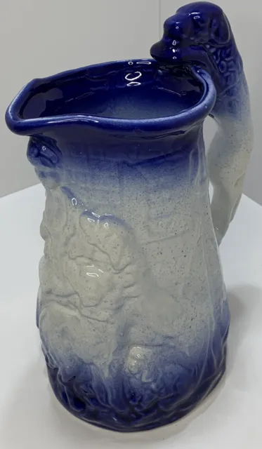 Vtg Art Pottery Blue & White Pitcher w Relief Design & Dog Handle Unknown Maker