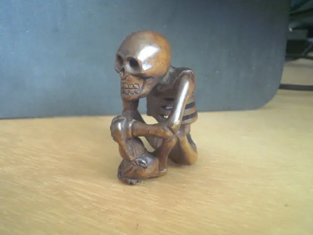 2b. Hand Carved wood netsuke Skeleton sits holding gourd bottle boxwood figure