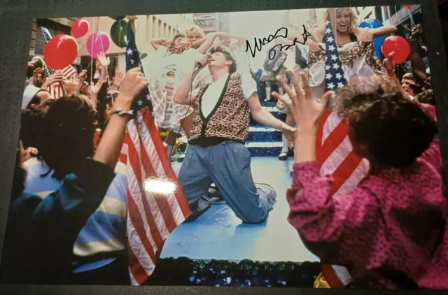 matthew broderick on his knees singing during a film scene signed 12x8 photo