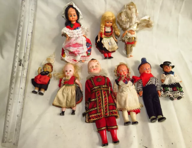 Collection of 9 small child & baby dolls