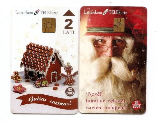 LATVIA 2 Chip phonecards - gingerbread house + Santa claus , Christmas