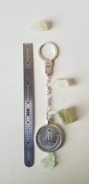 One 1934-45 one peso 0720 silver Mexican Coin 16.66 gms w .925  key chain