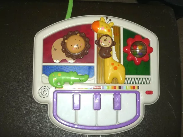 FisherPrice baby crib toddler battery operated piano along with other noises