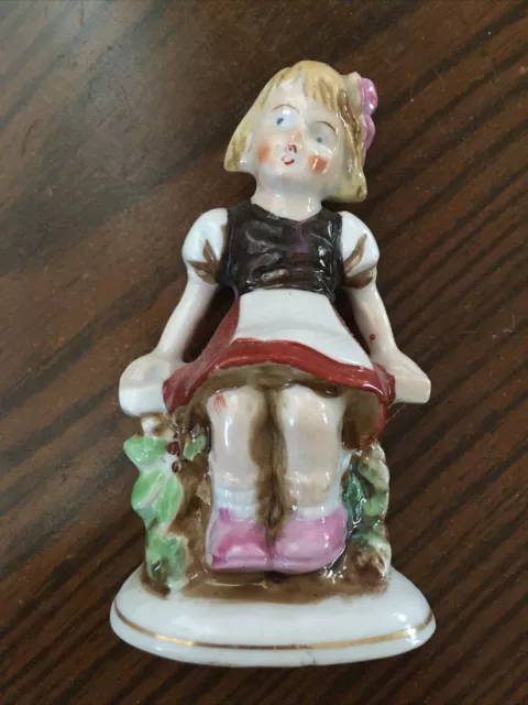 Vintage Porcelain Girl Figurine Sitting on a Fence Made In Occupied Japan