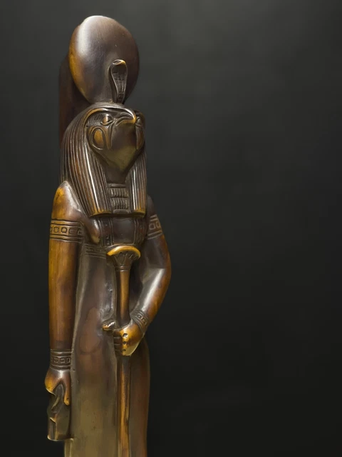 RA the god of sun with falcon face and wearing Sun disc with the Cobra