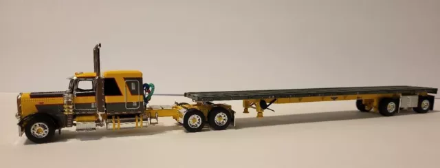 First Gear/ DCP 60-1478 Gray/ Yellow Peterbilt 389 w/ Wilson Spread Axle Flatbed