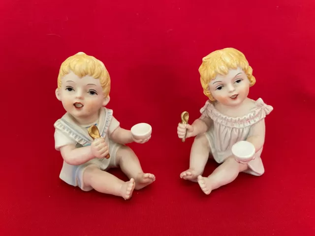 Vintage Large Bisque Porcelain Piano Babies Pair Boy and Girl with Bowls &Spoons