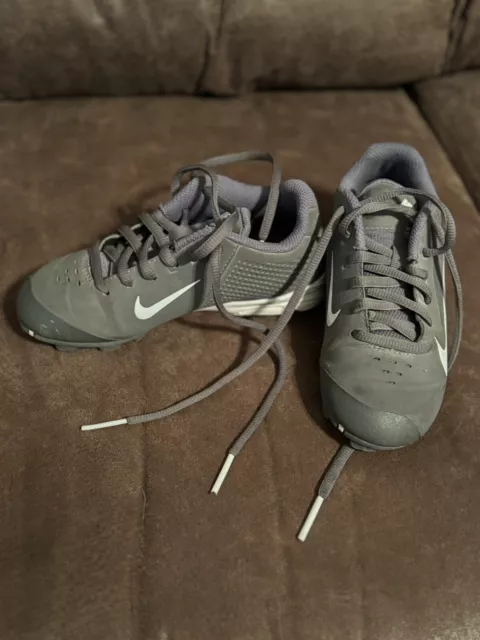 Boys Grey and White Nike baseball cleats size 12C