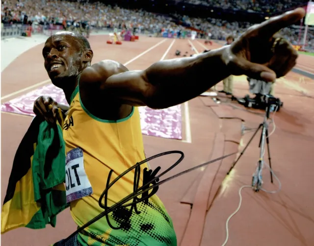 Usain Bolt Signed 10X8 PHOTO Olympics JAMAICA Genuine Signature GOAT AFTAL COA