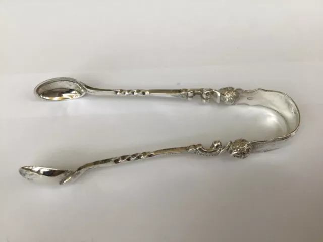 Very unusual ornate pretty  solid silver sugar tongs with face and body