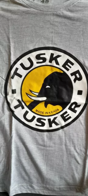 Tusker Beer t-shirt 💙  size LARGE New  Kenya HARIASTAMP Baada ya kazi...